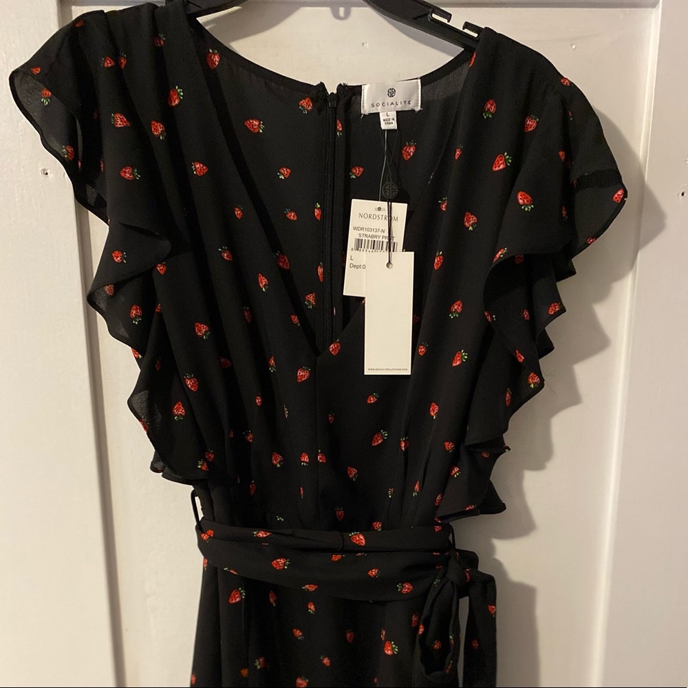 Black mid length dress with strawberry print.